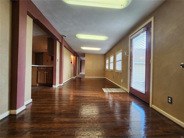 unfurnished room with dark hardwood / wood-style floors