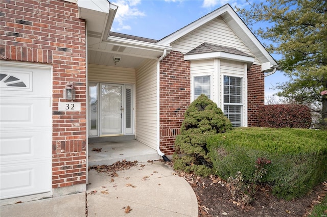 doorway to property featuring a garage