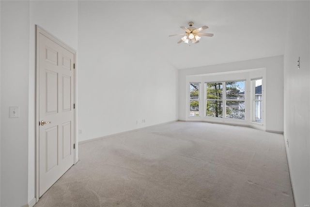 unfurnished room with light carpet and ceiling fan