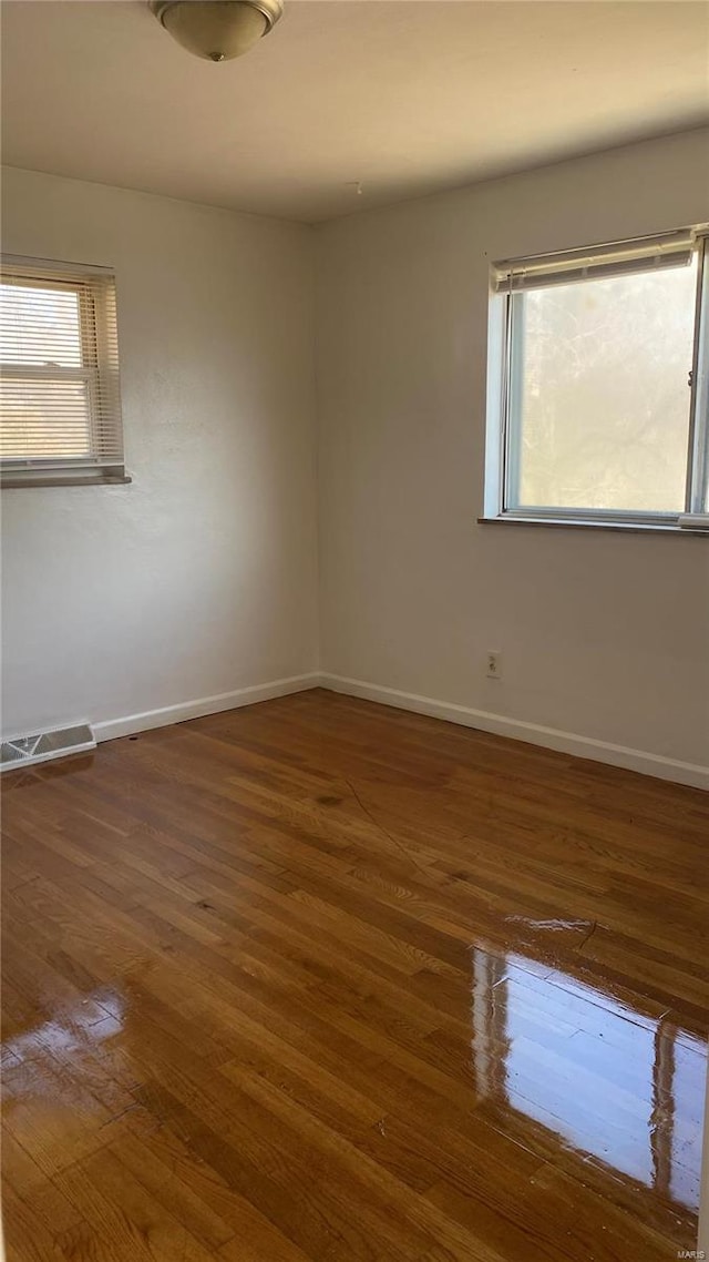 empty room featuring dark hardwood / wood-style floors