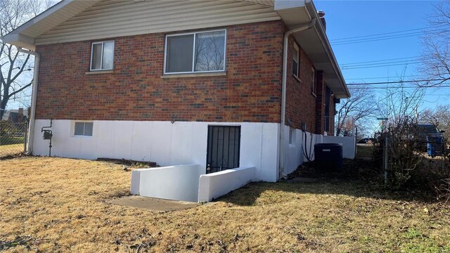 view of side of property featuring central AC