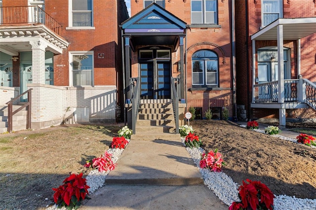 doorway to property featuring a balcony