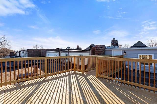 wooden terrace featuring a water view