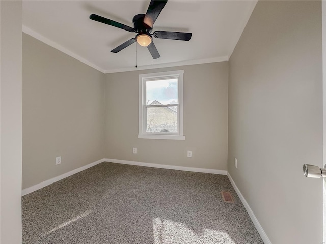 unfurnished room with ceiling fan, crown molding, and carpet