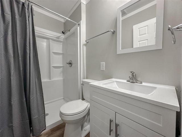 bathroom featuring vanity, hardwood / wood-style flooring, toilet, and walk in shower