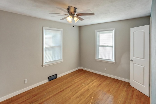 spare room with ceiling fan and light hardwood / wood-style floors