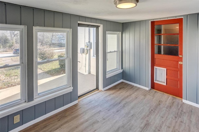 doorway to outside with light hardwood / wood-style floors