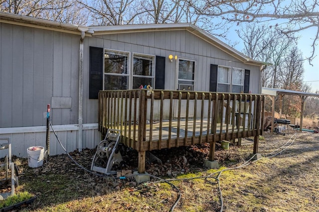 back of house with a wooden deck