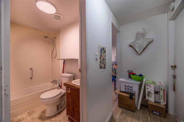 full bathroom with shower / bath combination, a textured ceiling, toilet, vanity, and hardwood / wood-style flooring