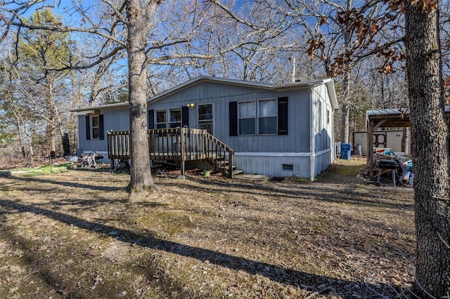 manufactured / mobile home with a wooden deck