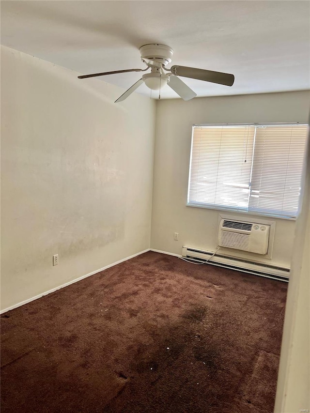 spare room featuring carpet flooring, a baseboard radiator, a wall unit AC, and ceiling fan