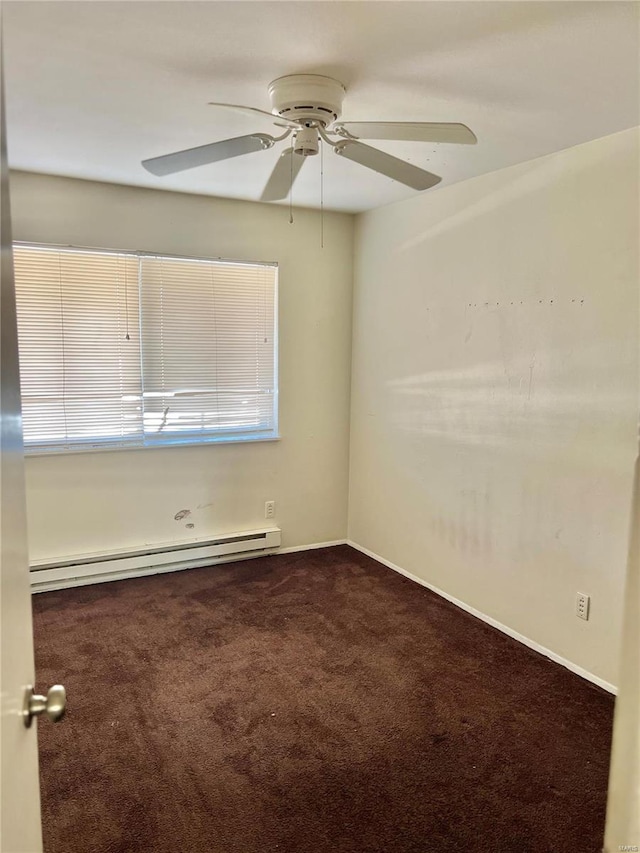 carpeted empty room featuring ceiling fan and a baseboard radiator