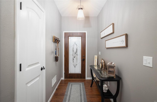 entryway with dark wood-type flooring