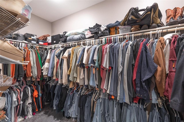 walk in closet featuring carpet flooring