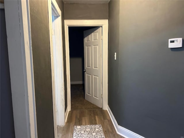 corridor featuring hardwood / wood-style flooring