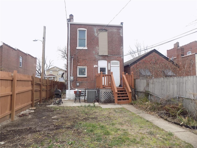 back of property with a patio area