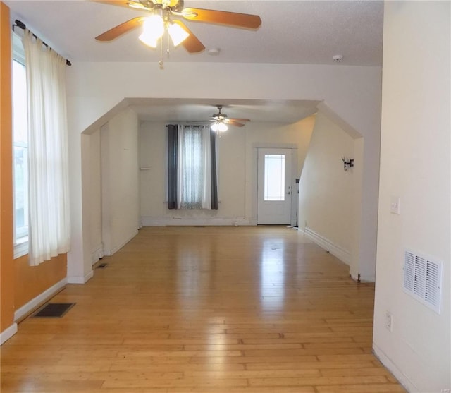 bonus room with a wealth of natural light, light hardwood / wood-style flooring, and ceiling fan