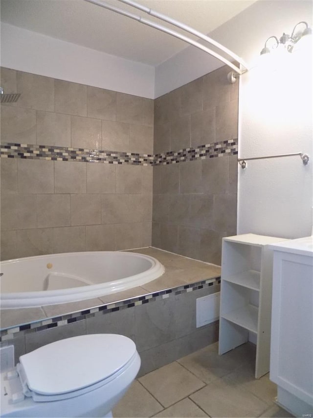 bathroom with tile patterned floors, vanity, and toilet