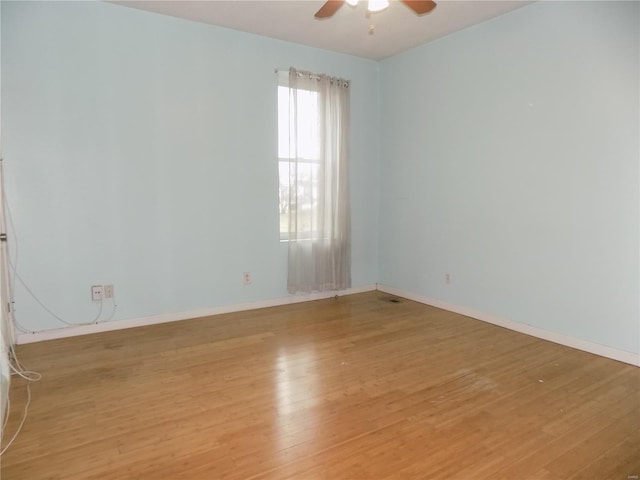 unfurnished room featuring ceiling fan and light hardwood / wood-style flooring