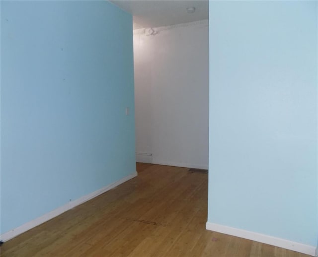 spare room featuring light hardwood / wood-style flooring