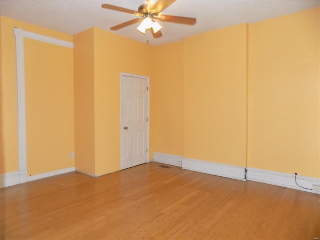 empty room featuring ceiling fan and wood-type flooring