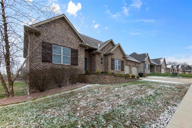 view of front facade featuring a front yard and a garage