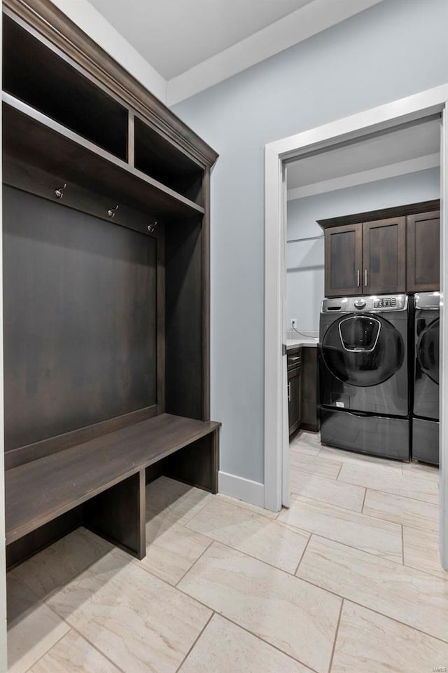 mudroom with washing machine and clothes dryer