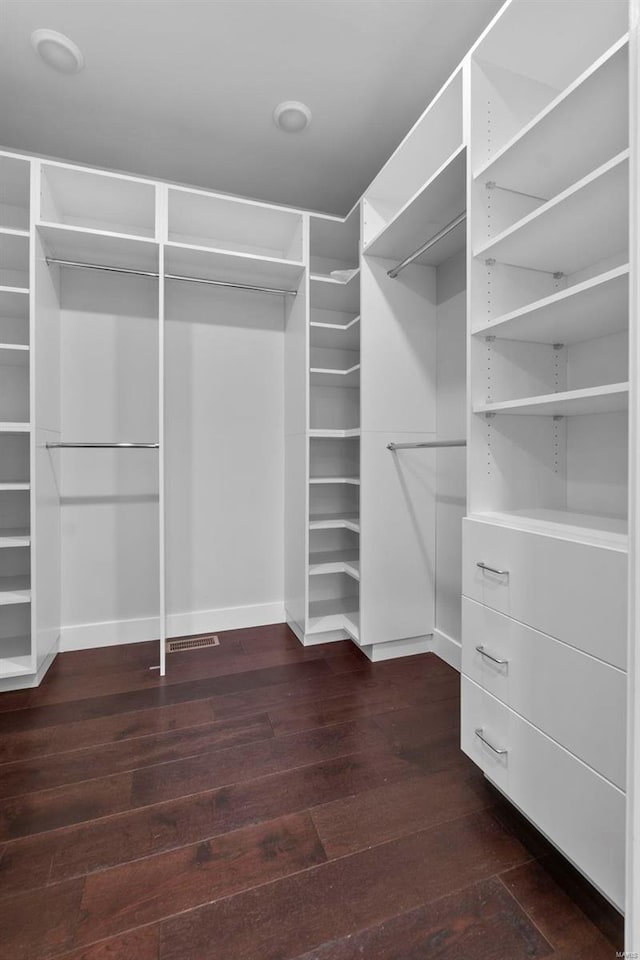 walk in closet featuring dark wood-type flooring