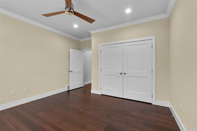 unfurnished bedroom featuring a closet, dark wood-type flooring, ceiling fan, and ornamental molding