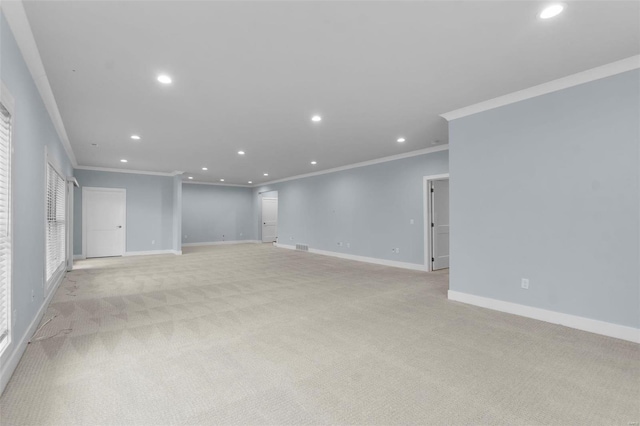 empty room with light carpet and ornamental molding