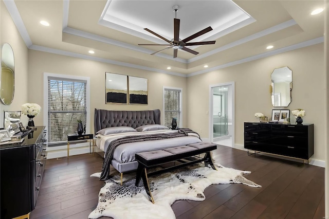 bedroom with ensuite bathroom, a raised ceiling, ceiling fan, and ornamental molding