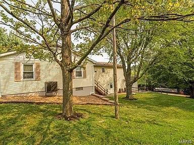 view of yard with central AC