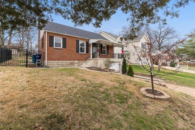 view of front of house featuring covered porch, a garage, and a front lawn