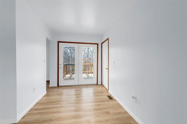 doorway with light hardwood / wood-style flooring