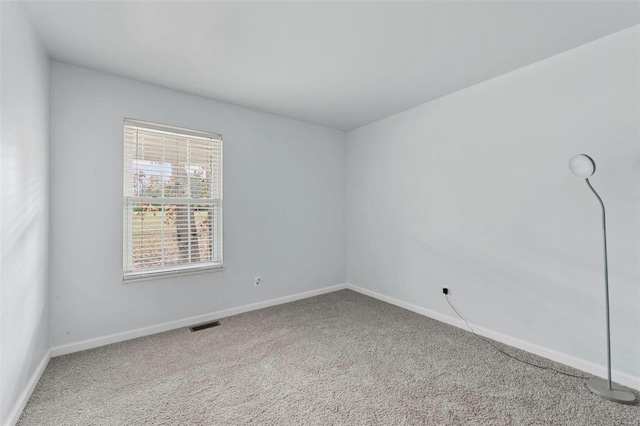 unfurnished room featuring carpet flooring