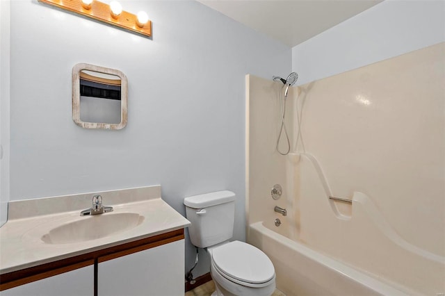 full bathroom with bathtub / shower combination, vanity, and toilet