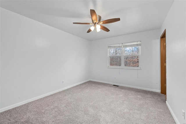 empty room with carpet and ceiling fan