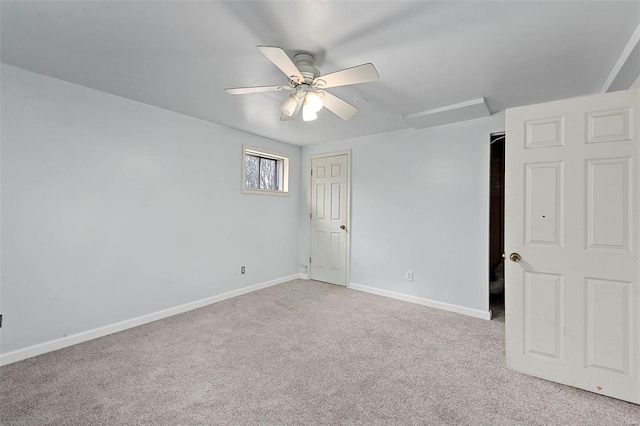 empty room featuring light carpet and ceiling fan