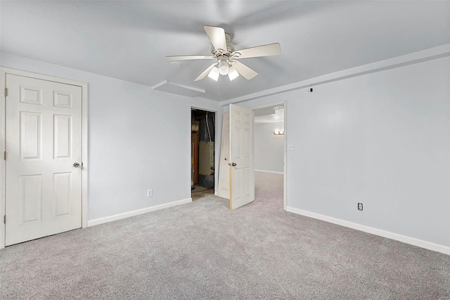 empty room with light colored carpet and ceiling fan