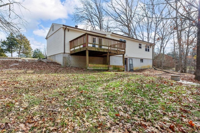 back of property featuring a deck