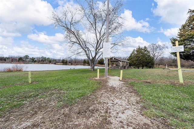 view of yard featuring a gazebo and a water view