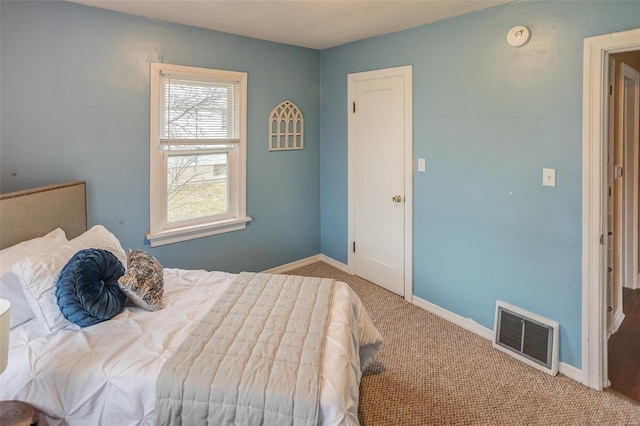 bedroom featuring light carpet