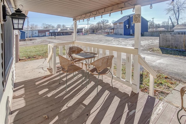 wooden terrace featuring covered porch