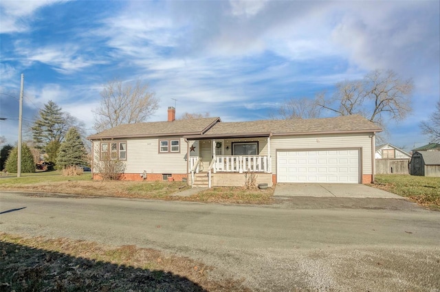 view of front of house with a porch and a garage