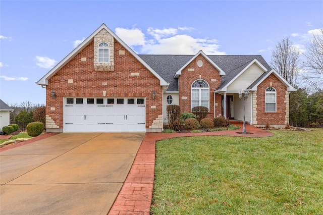 front facade with a garage and a front yard