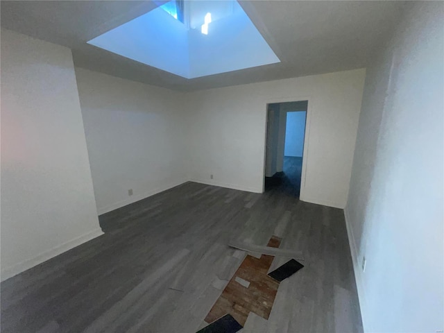 spare room featuring dark wood-type flooring