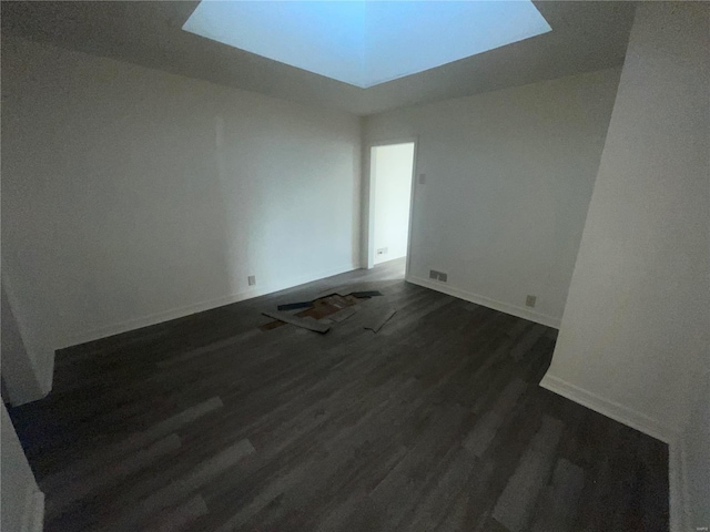 unfurnished room featuring dark hardwood / wood-style flooring