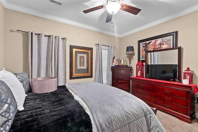 bedroom with carpet flooring, ceiling fan, and crown molding