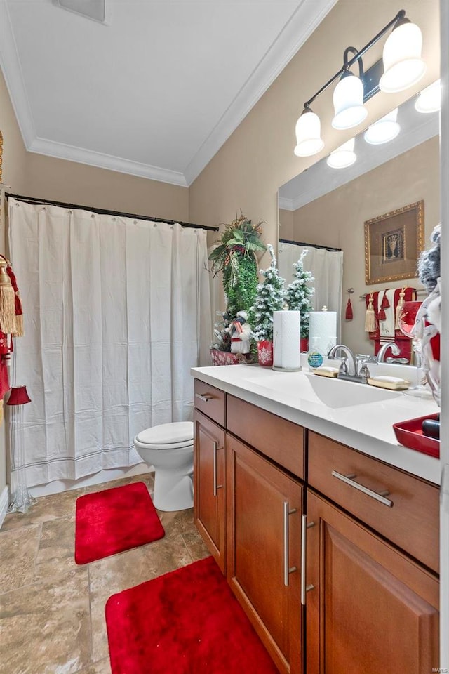 bathroom featuring vanity, toilet, and crown molding