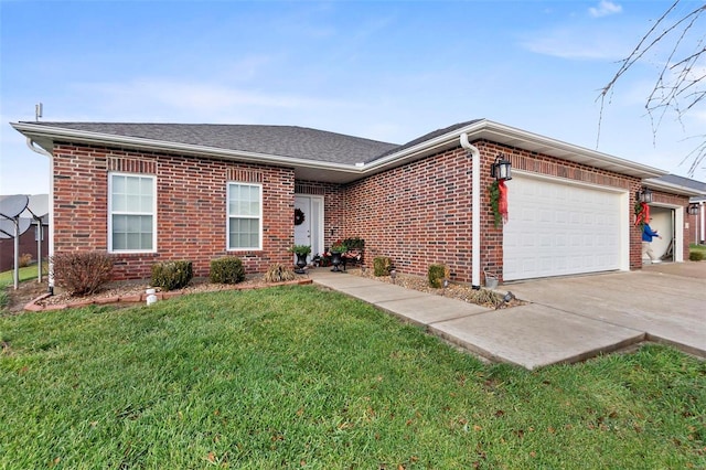 ranch-style home featuring a garage and a front lawn